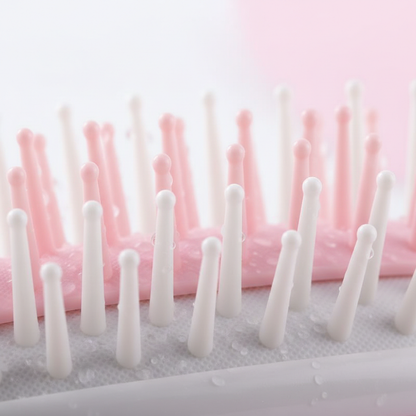 Gros plan poils flexibles brosse démêlante